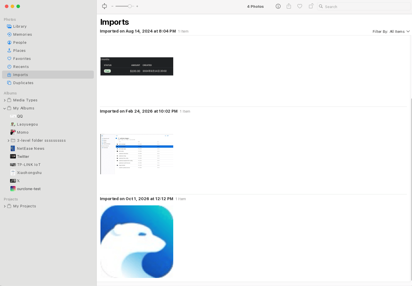 The Photos app on a Mac showing the Imports view, with each import batch listed by date and the albums in the sidebar